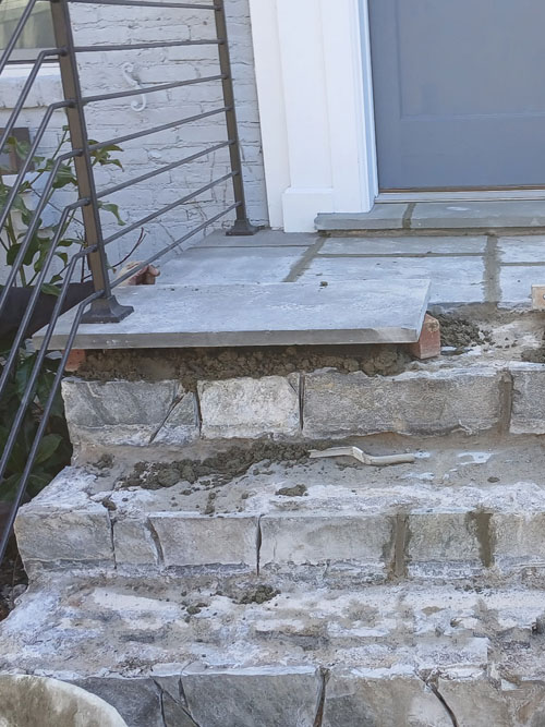 Front entry stair renovation with flagstone