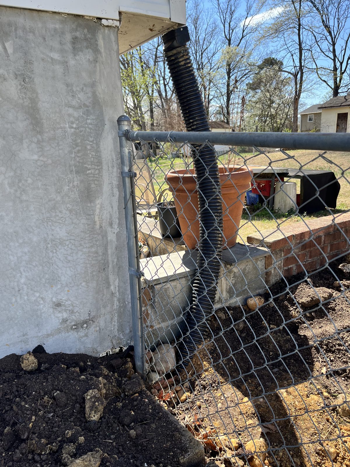 Completed project with trench backfilled and foundation sealed