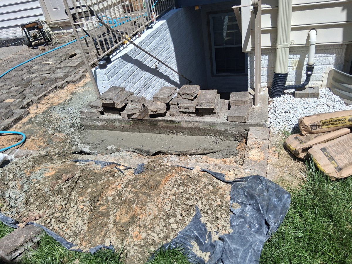 Void filled and new base being compacted and relaid