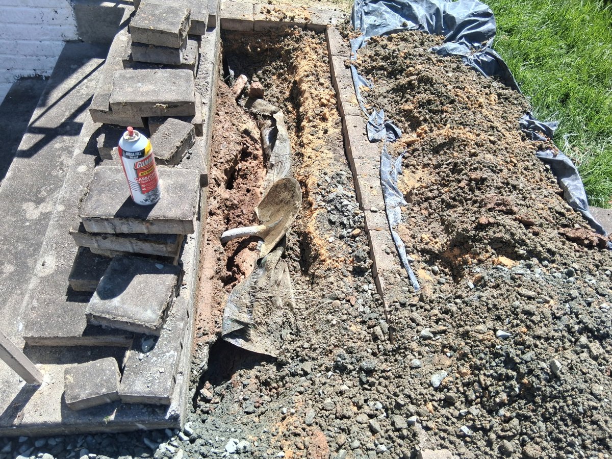 Pavers removed revealing large void and base washout
