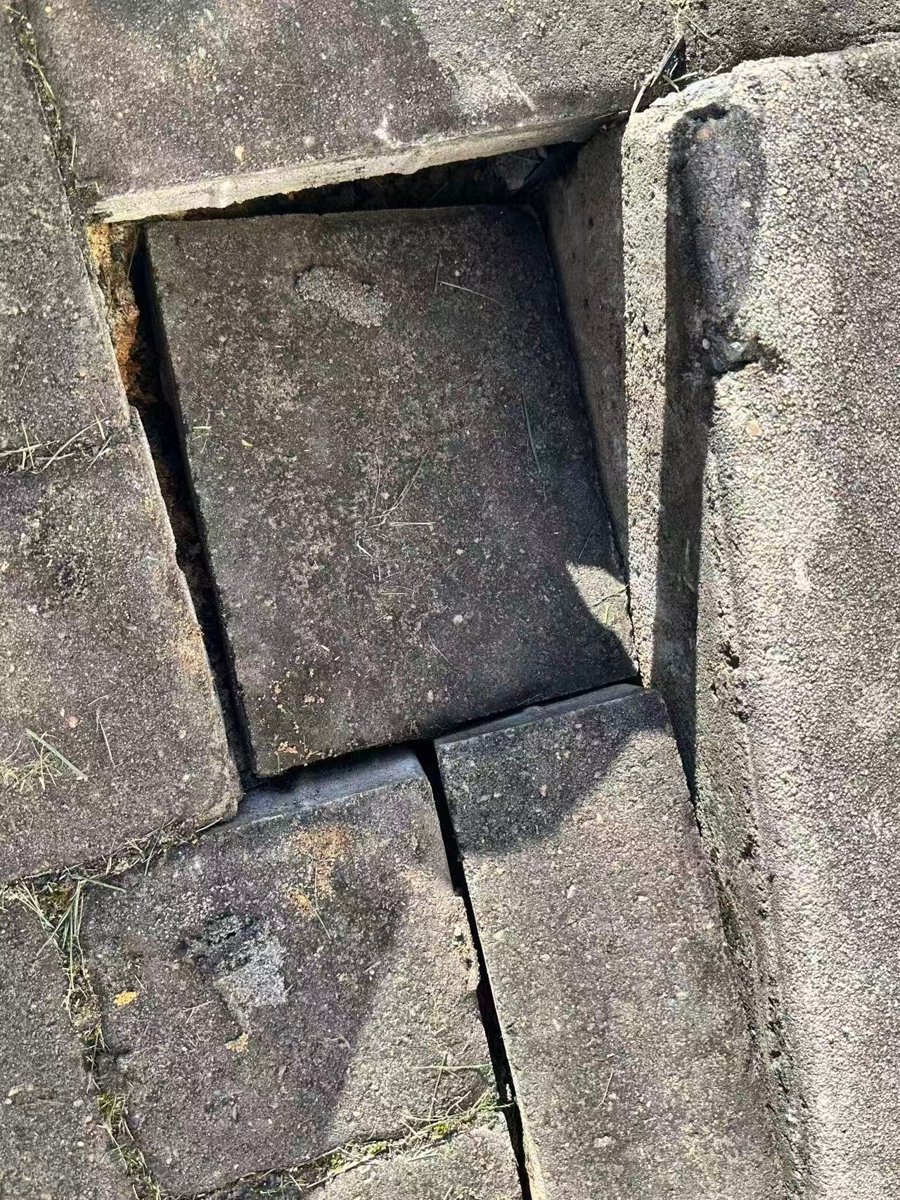 Sunken and shifted pavers before work began — Ashburn, VA